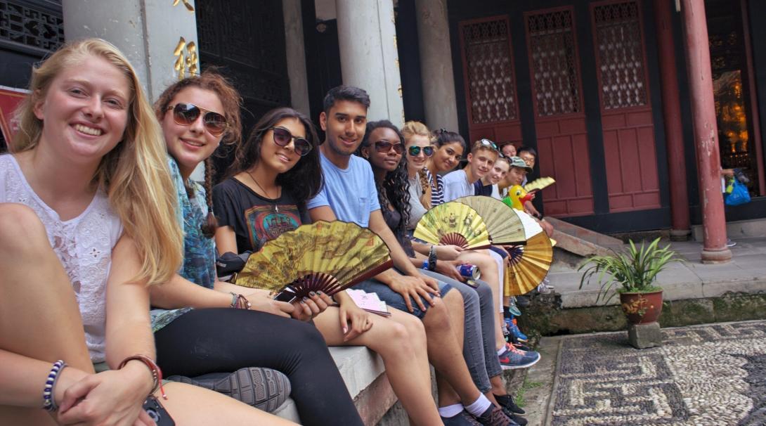 A group of Projects Abroad teenage volunteers working with children in China, visit a temple during a weekend trip. Volunteers doing teenage community work in China, visit a temple over the weekend.